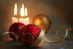 A display of Christmas ornaments in candlelight