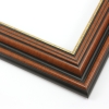This stepped, reverse scoop frame with raised outer edge features a walnut wash that highlights the natural wood grain.  The recesses of the profile are matte black, with a cracked gold foil on the inner lip.

1.75 " width: ideal for medium size images.  A wide variety of photographs, paintings and prints will be enhanced within this unique frame.